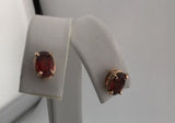14KY Garnet Studs E286