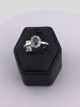 18KW Tanzanite with Diamond Halo R100